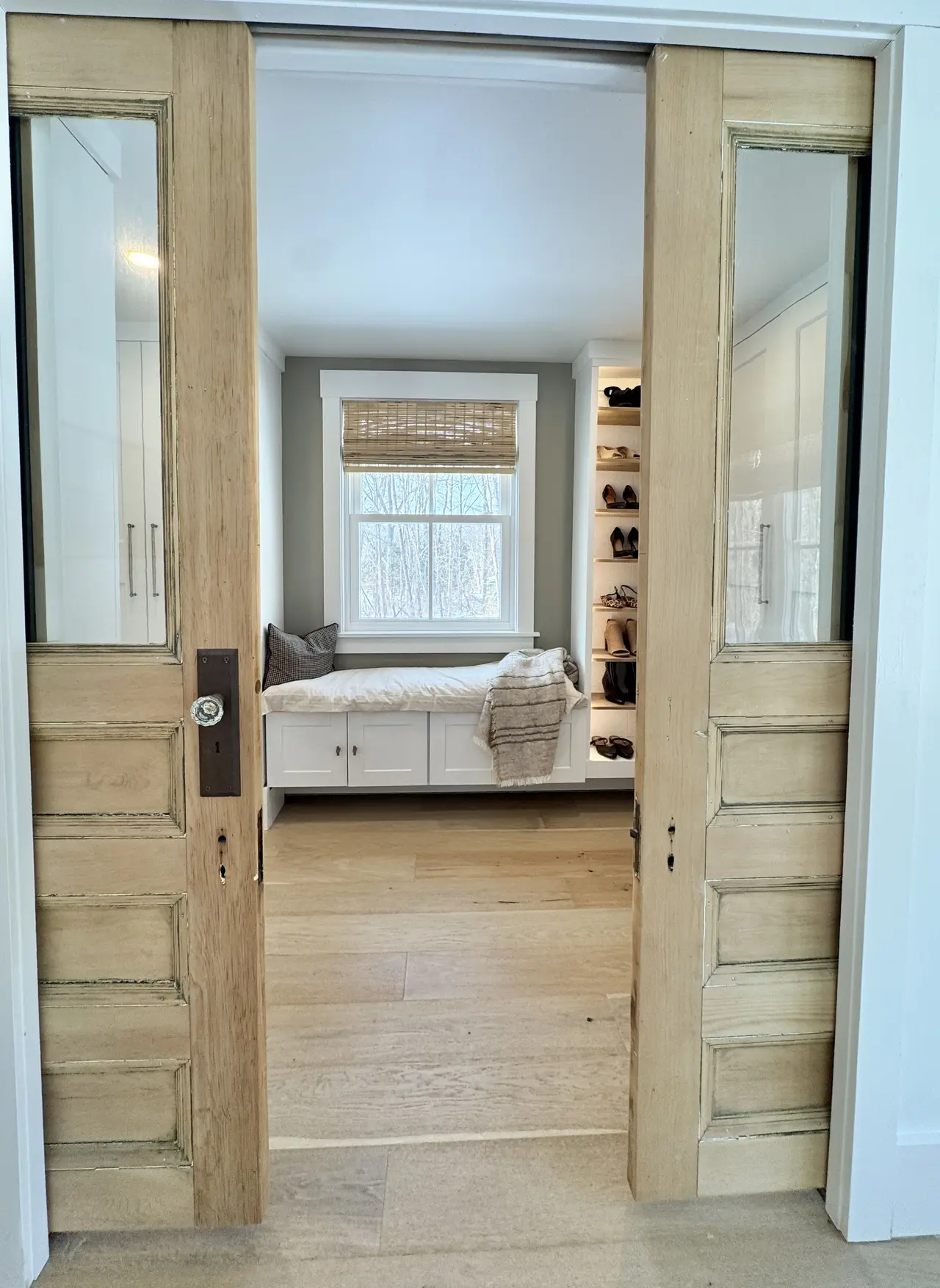 Reclaimed-wood sliding doors opening to the bedroom