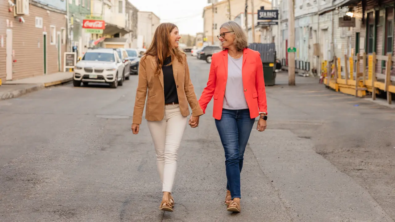 STELLAN owners Erica Biordi and Stephanie Peters walking hand in hand through the Old Port
