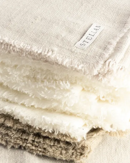 A stack of fringed STELLAN linens with the label showing