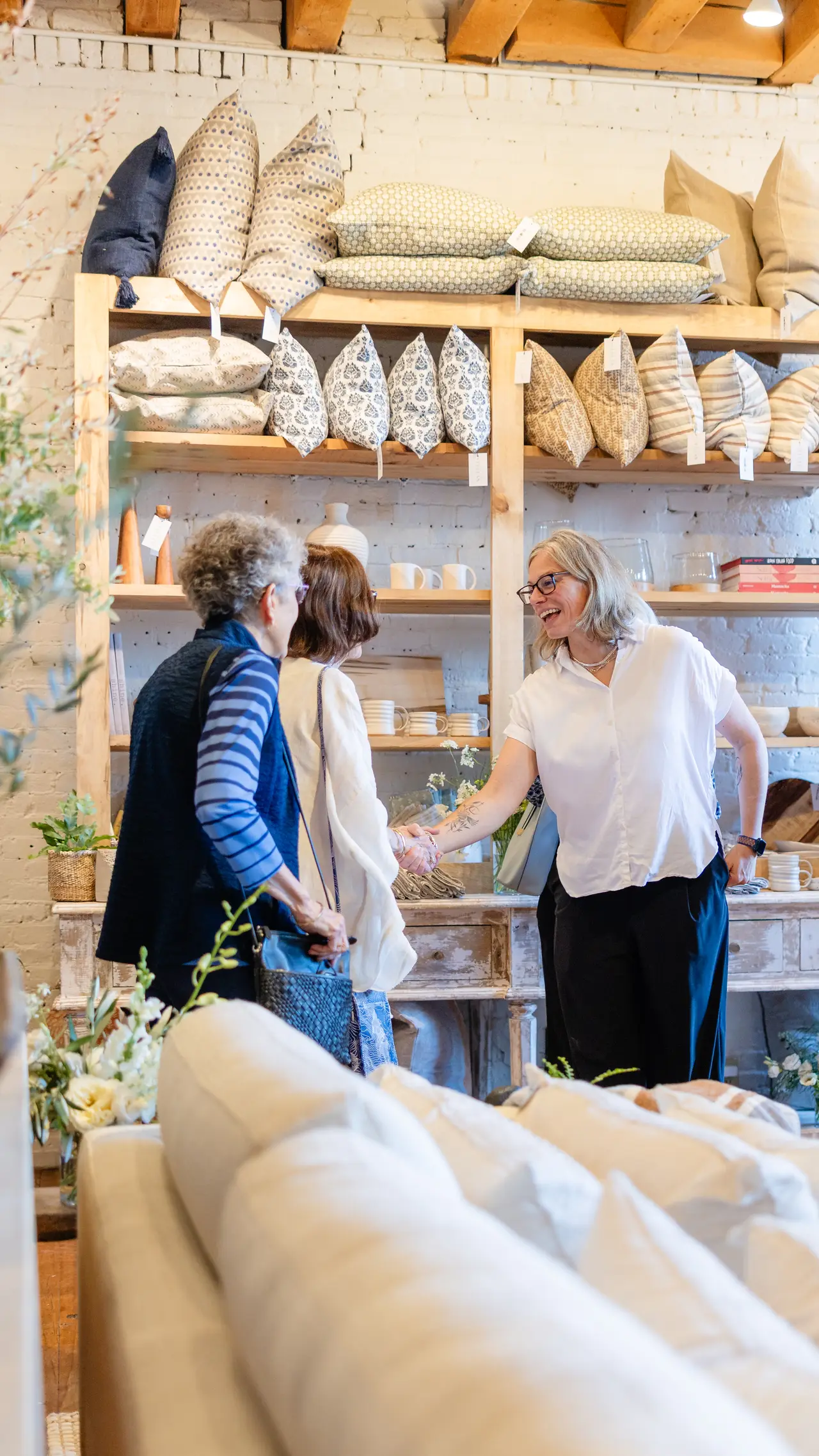Guests near the window at the Portland opening