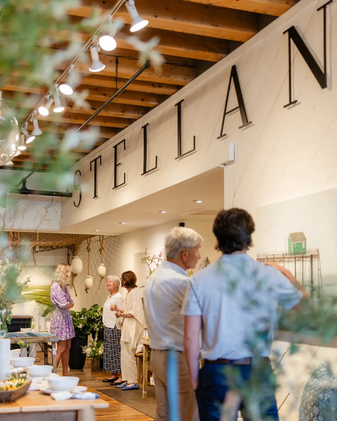 Friends browsing the shelves at the opening