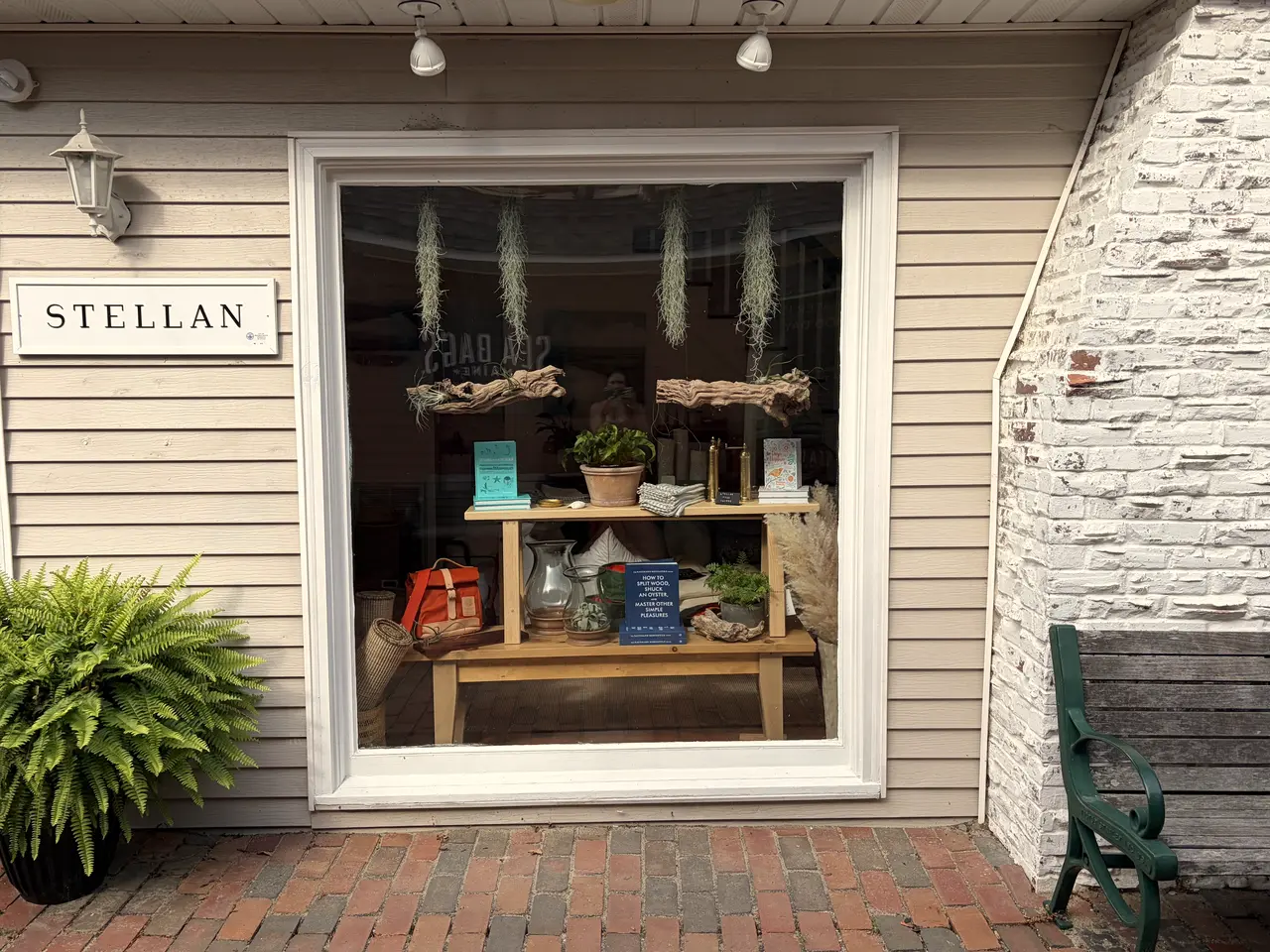 The STELLAN storefront window in Rehoboth Beach, a styled display off the brick sidewalk