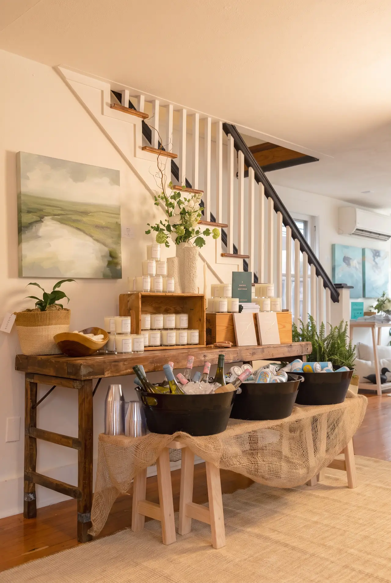 A console of products by the staircase in the Rehoboth shop